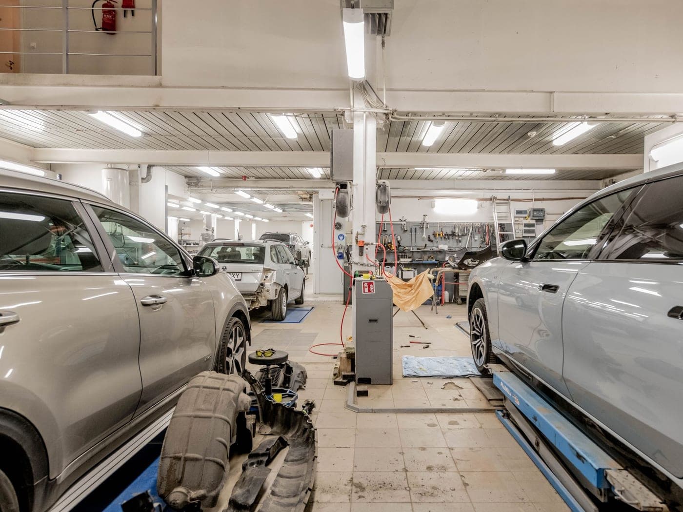 The Meridian Auto Care service floor with vehicles on lifts and organized tool stations