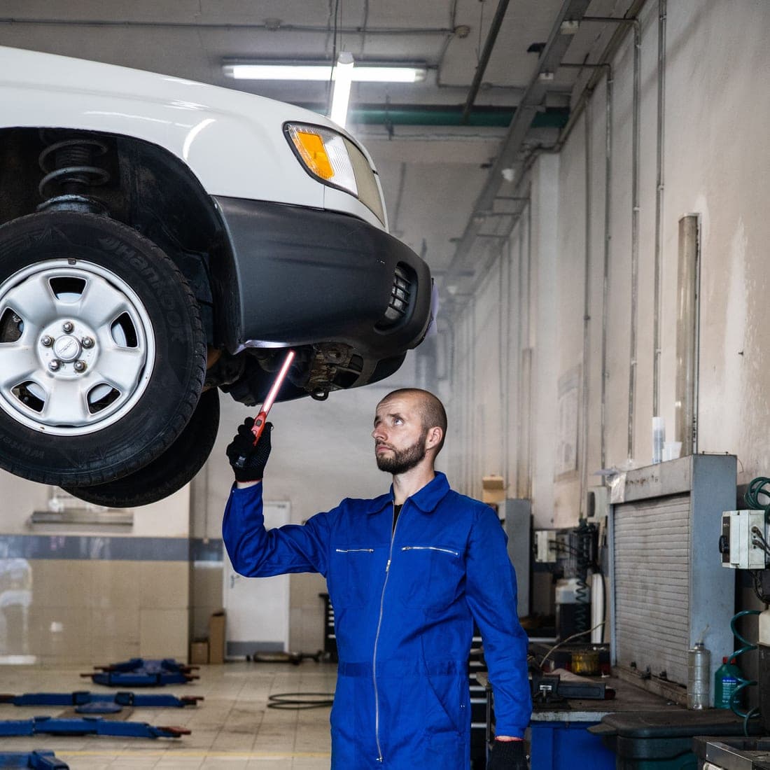 Technicians working together on a vehicle